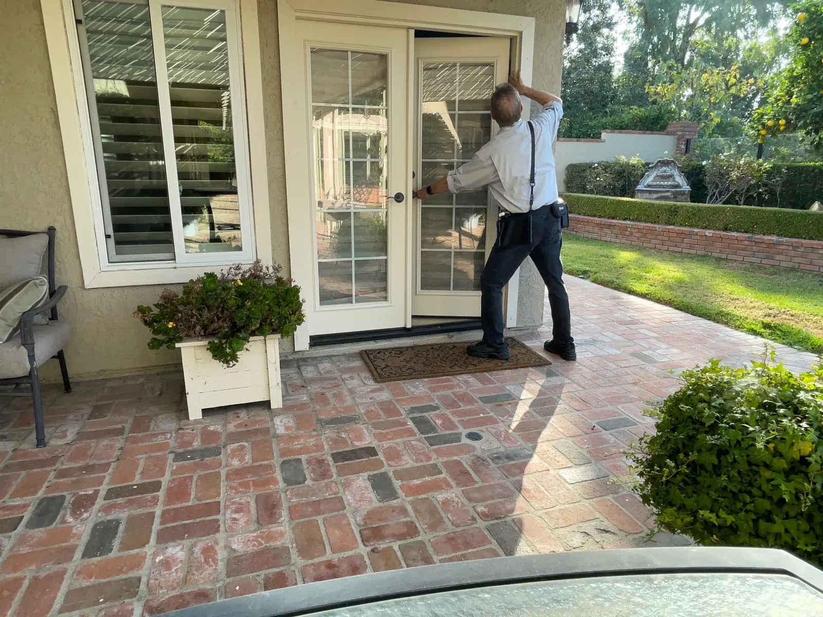 Rob Kruger inspecting exterior doors at a single family home